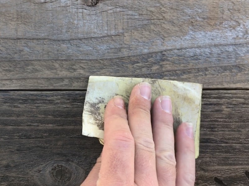 How To Attach PVC To Wood In The Best Ways 2 cleaning up reclaimed wood with sandpaper mountainmodernlife.com